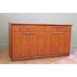 A 1970's Meredew Avalon sideboard with two drawers and two cupboards below
