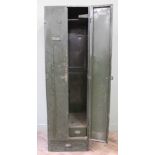 A pre-war dark green metal storage locker with internal drawer inside double locker doors and