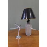 A chrome model aeroplane on stand and lamp made from a soda siphon (collector's item only)