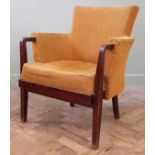 A 1960's mahogany framed Ginson and Slater Ltd armchair with mustard upholstery