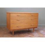 A 1970's chest of two short and two long drawers on round legs