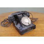 A vintage black bakelite telephone