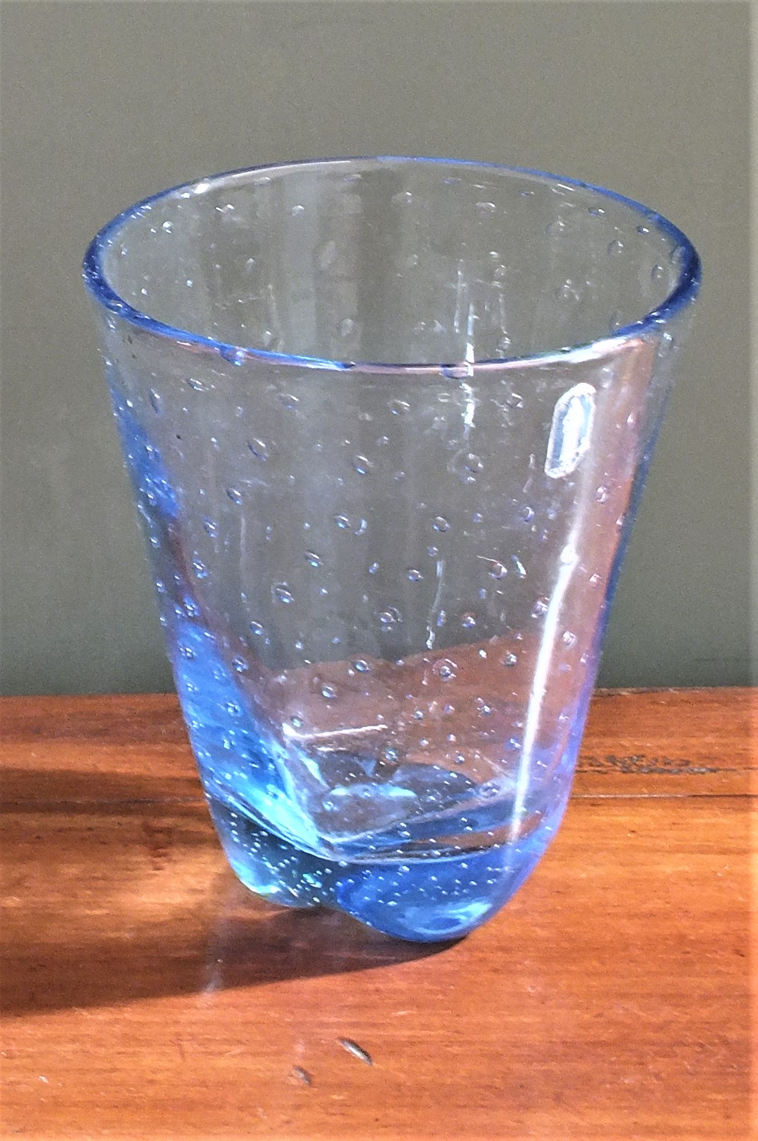 A blue Whitefriars glass vase with bubble effect decoration