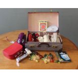A selection of vintage items including four telephones, two suitcases,