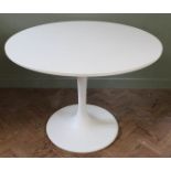 An Ikea white tulip style dining table