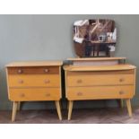 A 1950's dressing table with central lighting strip and a matching chest of drawers