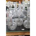 Sixteen various cut glass decanters plus thirteen various 19th Century and other glass decanters