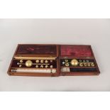 Two mahogany cased Sikes hydrometers,