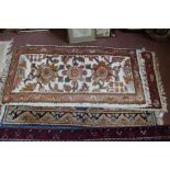 A Persian blue ground floral rug plus two Indian rugs