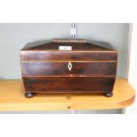 A 19th Century inlaid mahogany sarcophagus two compartment tea caddy