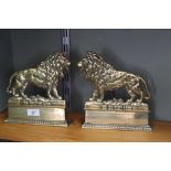 A pair of late Victorian brass lion door stops titled 'The British Lion' with Reg No,