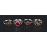 Four silver stone set rings