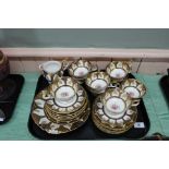 A Royal Crown Derby gilt and floral part tea set