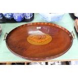 A Victorian oval mahogany galleried tray with inlaid shell paterae