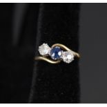 An 18ct platinum set sapphire and diamond three stone ring,