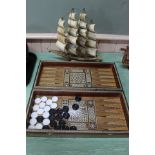An inlaid back gammon board plus a horn galleon