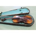 A cased violin and bow