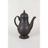 A 19th Century Basalt coffee pot with widow on dustbin finial