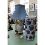 A Japanese blue and white floral stick stand plus two porcelain table lamps