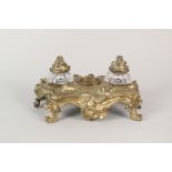 A 19th Century gilt metal Rococo two bottle inkstand