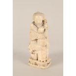 A 19th Century Chinese ivory group of a mother and children,