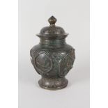 A Chinese bronzed lidded vase with relief animal decoration, mark to base,