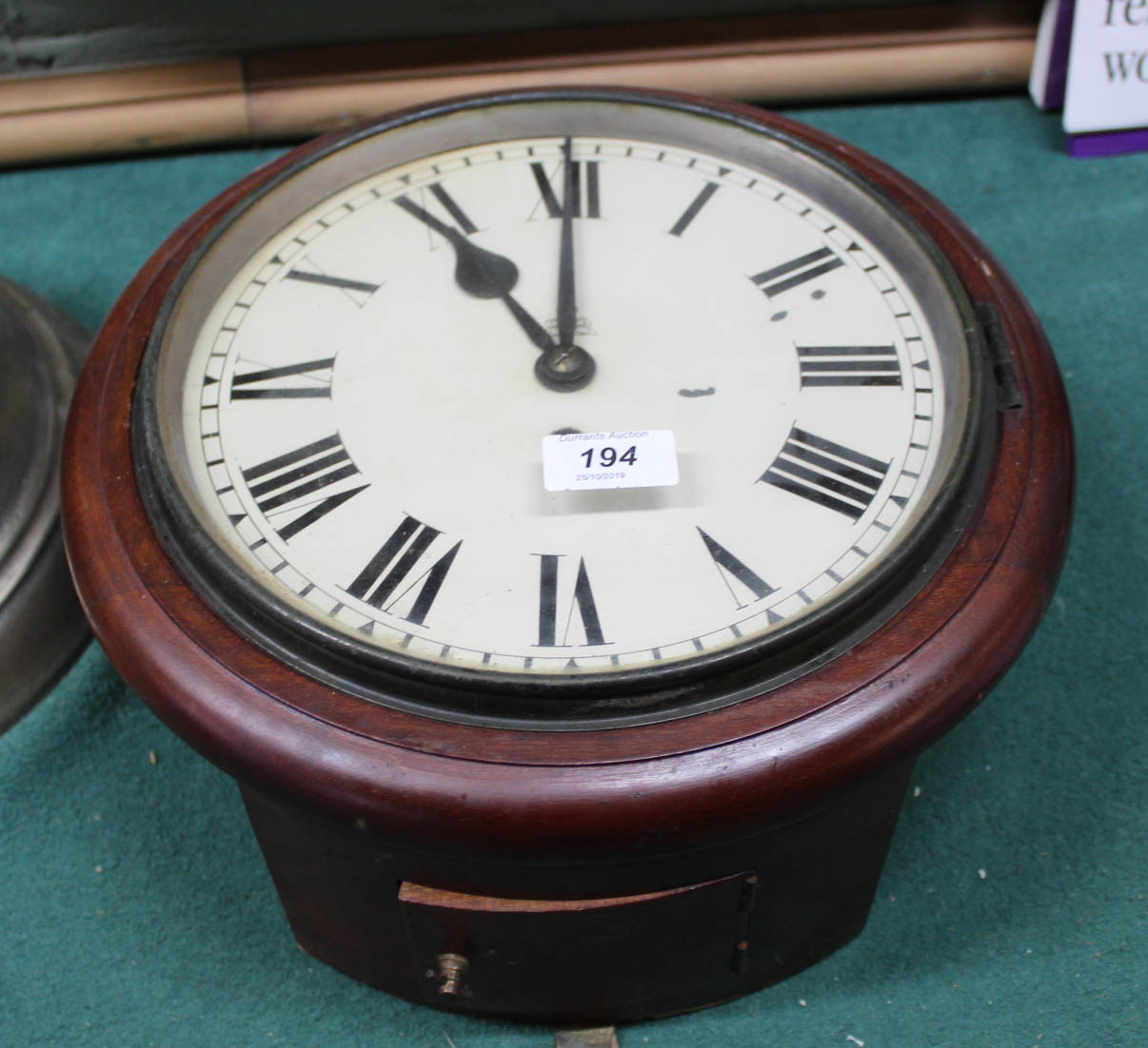 A circular mahogany fusee wall clock