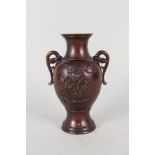 A Japanese bronzed vase with relief bird and floral decoration,