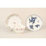 An 18th Century fluted tea bowl and saucer plus a blue and white floral saucer (both as found)