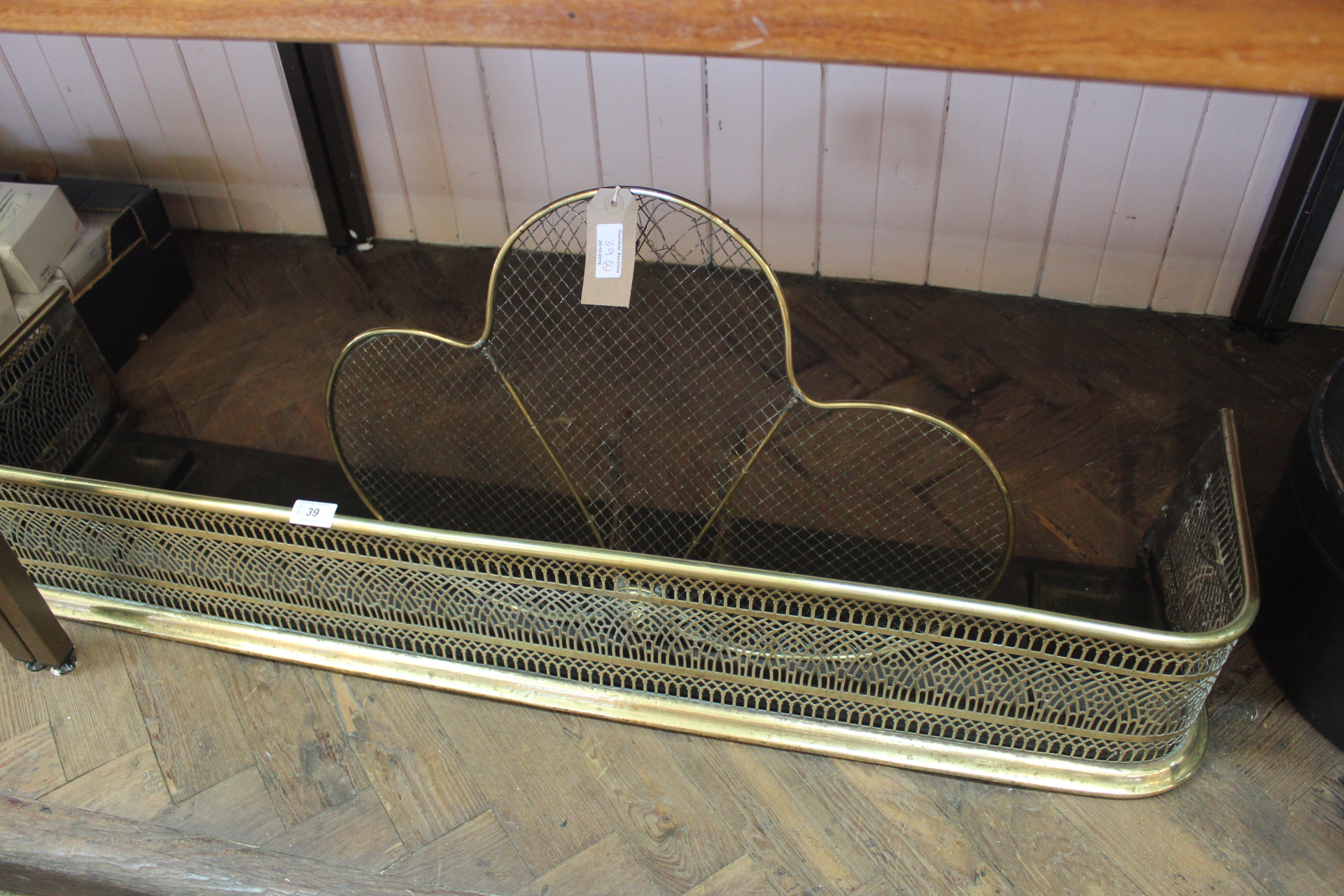 A 19th Century fretted brass fender,