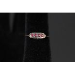 A 9ct gold four stone ruby ring
