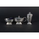 A silver three piece cruet set