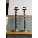 A large pair of late Victorian open barley twist brass candlesticks with drip trays and wide dished