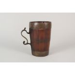 An 18th Century Scandinavia wood and brass banded tankard