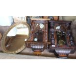 Two mahogany Vienna wall clocks plus an oval gilt wall mirror