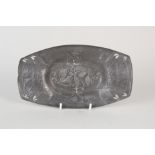 An Art Nouveau pewter dish marked 0547 in the style of Archibald Knox