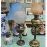 Three brass and glass oil lamps (one converted)