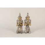 A pair of Thai gilt metal seated deities,