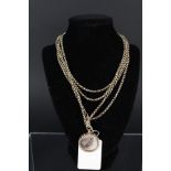 A 9ct gold long guard chain with 15ct gold framed double photo pendant