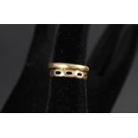 A 22ct gold wedding band and a 22ct gold pierced band (as found)