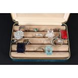 A box of mixed silver and costume rings