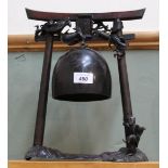 A Chinese gong on metal and wood stand with dragon decoration