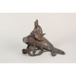 A Japanese bronzed figure riding a carp,