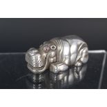 A Faberge silver hippo with ruby eyes,