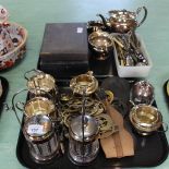 A silver plated three piece tea set, condiment jars,