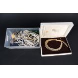 A box of various costume jewellery and a small quantity of silver jewellery including brooch,