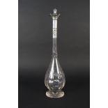 A silver mounted cut glass decanter with silver pierced collar flared edge, by William Hutton,