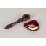 A cased Meerschaum cheroot holder plus a novelty wooden golf ball nutcracker