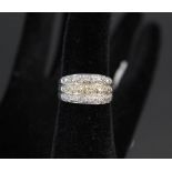 A 9ct white gold three row band ring set with small diamonds, approx 0.