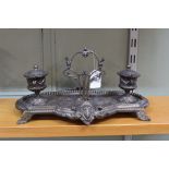 A Victorian brass embossed foliate and classical urn designed double inkwell stand